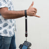 cinched black cuff on wrist when camera was dropped