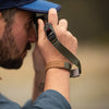 Adam wearing his sage cuff with his camera