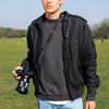 Alvin carrying his camera with the black leash as sling carry