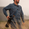 Adam wearing his midnight slide with camera as sling carry