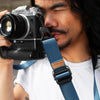 Alvin using his camera connected to midnight slide lite strap