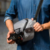 Capture clipped on an everyday sling, hover-img