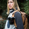 Anne using her Silver Capture on her Everyday Backpack with a camera clipped on it