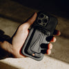 John firmly holding his iPhone with Everyday case and mobile tripod flatten on it