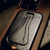 A flatten Carryology Mobile Tripod attached to an iPhone with Everyday case