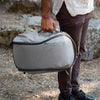 Briefcase carry style of the Ash Backpack Zip using the grab handle on the side