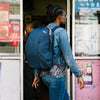 Anne strolling down the street with her Midnight Everyday Backpack Zip