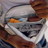 Inside Outdoor Sling with camera and a wallet
