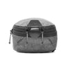 Small packing cube zip and tabs to grab to tear away the main opening