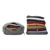 Clothes compressed inside the Medium Sage Packing cube