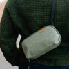 carrying a sage small tech pouch 