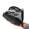 Smaller accessory pockets with pens, SD cards, batteries, and more inside black tech pouch