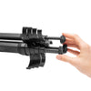  Grabbing the tripod feet and deploying the legs