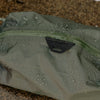 Showcasing weatherproof feature of ultralight packing cube