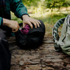 Actual usage sideview of black ultralight packing cube