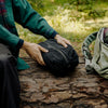 holding black ultralight packing cube inside a bag, hover-img