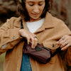 A girl using eclipse variant of ultralight packing cube