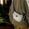 Closer look of a guy using cloud variant of ultralight packing cube