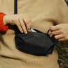 A guy using the double extra small ultra light packing cube